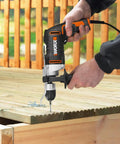 Knockout Impact Drill Packing 810 Watts And A Beefy 13 Mm Chuck Featuring Variable Speed Control in use on wooden deck.