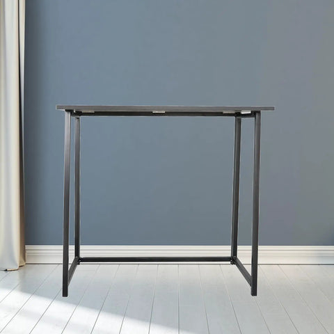 Rock Solid Collapsible Gaming Desk, No Sweat Folding Laptop Table For Home Office Hustle, black particleboard workstation viewed from front.