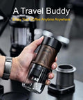 Manual Espresso Maker For On The Go Portable Coffee Machine With 2 In 1 Bottomless Portafilter in hand, stainless steel with 80ml tank