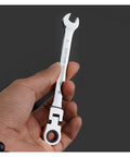 Hand holding a ratchet spanner from the Ratchet Spanner Set 5 7 12 Piece Kit For Car Repair, chrome finish, close-up view.