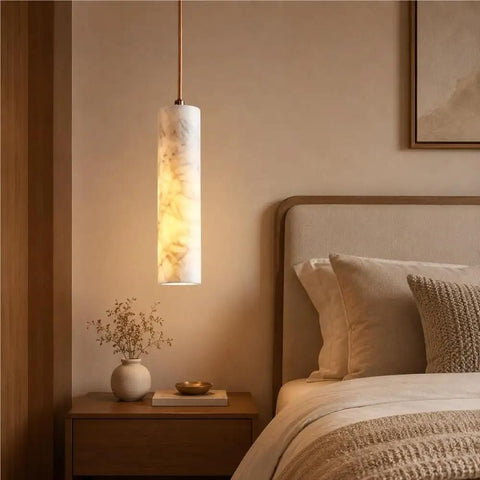 Alabaster Pendant Light Natural Marble Long Tube Hanging Lights with Wood Ceiling Canopy Modern Nordic Mini Pendant Lamp for Kitchen Island Bedroom Hallway(25 * 6cm) illuminating a cozy bedroom.