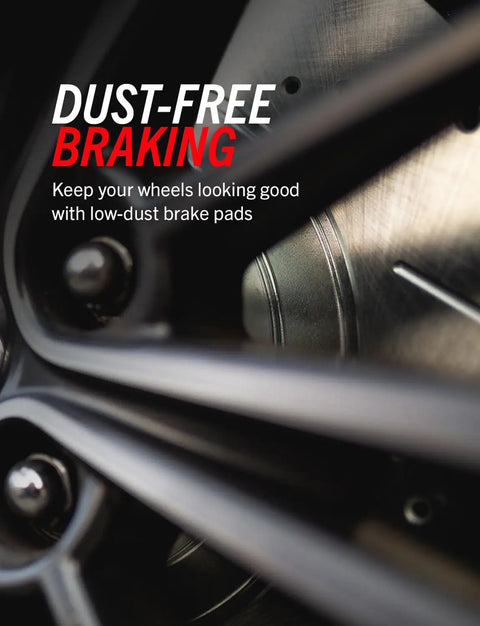 Close-up of front and rear brake kit with carbon fiber ceramic pads and drilled and slotted rotors for detailed braking system view.