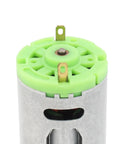 Close-up of 6 To 24V DC Micro Motor With 6000 To 24000 RPM High Speed Stainless Steel Beast showing green top and terminals.