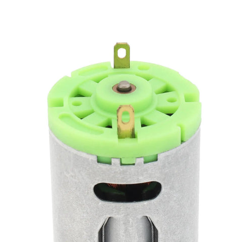 Close-up of 6 To 24V DC Micro Motor With 6000 To 24000 RPM High Speed Stainless Steel Beast showing green top and terminals.