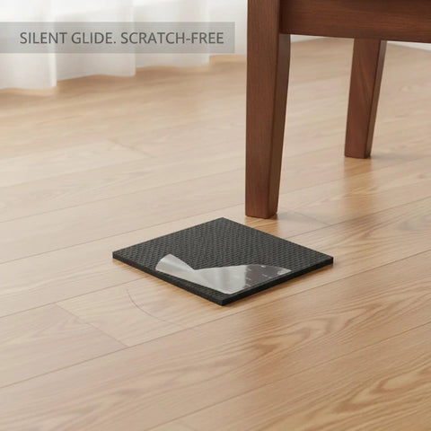 Self-Adhesive EVA Furniture Leg Pads For Floor Protection, Black Cushioning Glides shown under wooden chair leg on hardwood floor