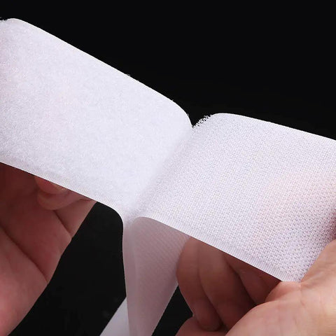 Heavy-Duty Sew-On Hook And Loop Tape Duo - Killer 3/4 Inch White Strips held in hands, showcasing non-adhesive nylon texture.