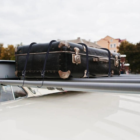 Heavy Duty Bungee Cords With Hooks Eight Pack in use securing luggage on car roof rack outdoors