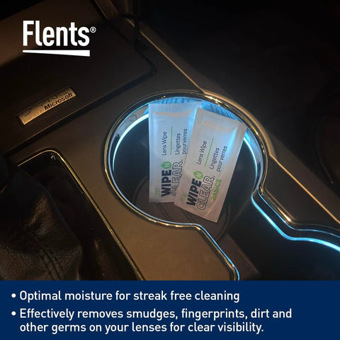 Flents Lens Wipe packets on car console; two packets of pre-moistened, streak-free wipes.