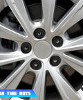 Close-up of wheel with 20 Pcs Lug Nut Covers 17Mm Bolt Caps With Removal Tool For Jetta Beetle Passat GTI Black Nylon Wheel Nut Caps Replacement OEM 1K0 601 173 Tire Bolt Covers Compatible