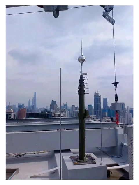 Pro Grade Manual Telescopic Aluminum Mast Expands From Two Point Five Meters To Ten Meters on rooftop with nearby skyline.