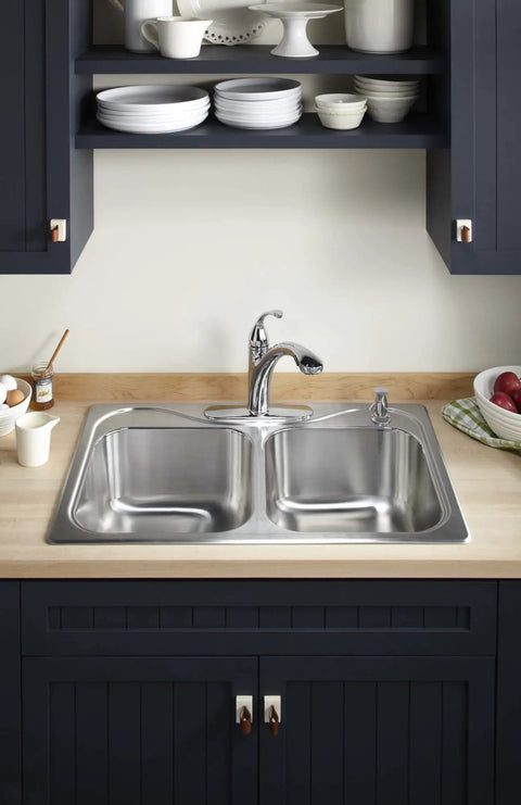 Contemporary Kitchen Sink Soap Dispenser 16 Oz For Liquid Soap Dishwashing Liquid Or Hand Lotion Polished Chrome Easy Top Fill Refillable No Mess Install Sleek Modern Finish Keeps Countertop Tidy next to sleek modern faucet against a wooden countertop and dark cabinetry backdrop.