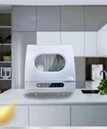 Compact Portable Countertop Dishwasher Offering No Sweat Installation And Smart Auto Wash Cycles Perfect For Small Kitchens Where Convenience Is King Plus Built In Antivirus Sterilizing Tech Keeps Dirty Plates Clean All Day Long on a kitchen counter.