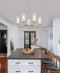 5-Light Modern Chandelier With Clear Glass Shades And Brushed Nickel Finish For Dining Room Living Room Bedroom Home Decor Contemporary Ceiling Lighting Fixture hanging over kitchen island