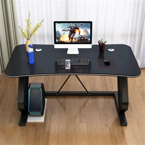 Modern White Gaming Desk Featuring A Built In Phone Slot And Side Storage Shelf, Ergonomic Arc Edge Layout For Smooth Typing, Hella Durable Pc Workstation Ideal For College Rooms Or Epic Gaming Setups with monitor and keyboard setup.