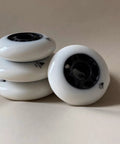88A Inline Skate Wheels 76mm And 90mm Replacement Set For Roller Blades, white PU wheels, stack view without bearings.