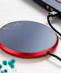 Electric Coffee Mug Warmer Heats Your Daily Brew Piping Hot With Precise Auto Timer And Dual Heat Settings Built From Scratch Safe Tempered Glass For Hella Reliability And Chill Desk Vibes on a desk with laptop