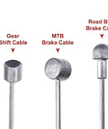 Close-up of gear shift, MTB brake, and road bike brake cables from Universal Bike Brake Cable And Housing Kit 9.8 Feet Black With Cables.