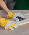 Person using 320 Grit Sandpaper Pro Grade 9 By 11 Inches Pack Of 30 Sheets Silicon Carbide on wood surface for sanding