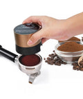 Close-up of Precision 58mm Espresso Tamper And Leveler Stainless Steel Barista Tool adjusting coffee grounds in portafilter.