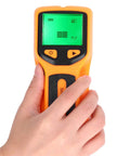 Greensen Stud Finder Wall Scanner 5 in 1 with HD LCD Display for Wood & AC Wire Detection (Yellow) held by a hand.