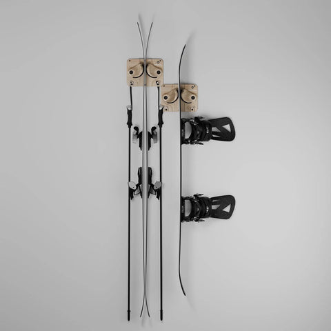 Ski And Snowboard Wall Mount Rack For Garage And Home Storage. Solid wood hooks gripping skis and snowboard on a wall.