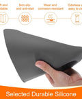 Hand holding a gray Anti Static Foldable Non Slip Premium Flexible Silicone Soldering Mat 15 Point 8 By 11 Point 8 Inches.