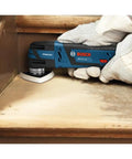 Worker using 12V Max EC Brushless Starlock Oscillating Multi Tool Bare Tool with 3-D Starlock Interface for precise edge sanding.