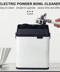 Top Shelf Electric Knock Box And Commercial Portafilter Cleaner on a table, compact design for easy cleaning and operation.