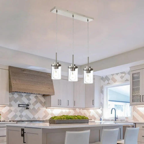 Black Island Pendant Lighting 5 Light Farmhouse Rectangle Linear Chandeliers With Clear Glass Shades in a kitchen setting.