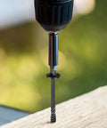 Pro Level Lag Screws For Heavy Duty Framing Number Fourteen By Two Point Five Inch Carbon Steel Wood Construction Fasteners being driven into wood.