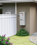 Whole House Liquid Propane Tankless Water Heater For Outdoor Installations mounted on exterior wall next to garden.