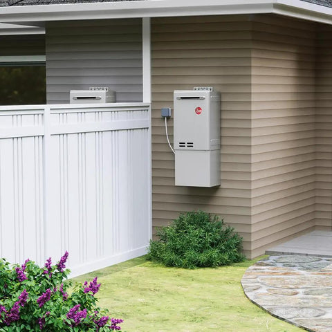 Whole House Liquid Propane Tankless Water Heater For Outdoor Installations mounted on exterior wall next to garden.