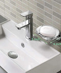 Powerful Suction Cup Soap Dish for Shower and Kitchen No Drill Mount Holds Up to 7.5 Pounds Easy No Tool Install Elegant Arc Design With 5 Drain Holes Drains Water Fast Keeps Soap Dry and Ready for Use mounted on a bathroom sink wall.