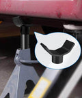 Universal 12 Ton Bottle Jack Adapter installed on a bottle jack under a vehicle frame, showing cradle style for stable axle lift.