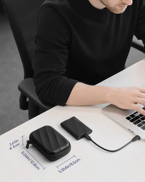 Person working at desk with Hard Case For T9 T7 Shield T7 Portable SSDs Custom Fit Protective Carry Case In Black beside laptop