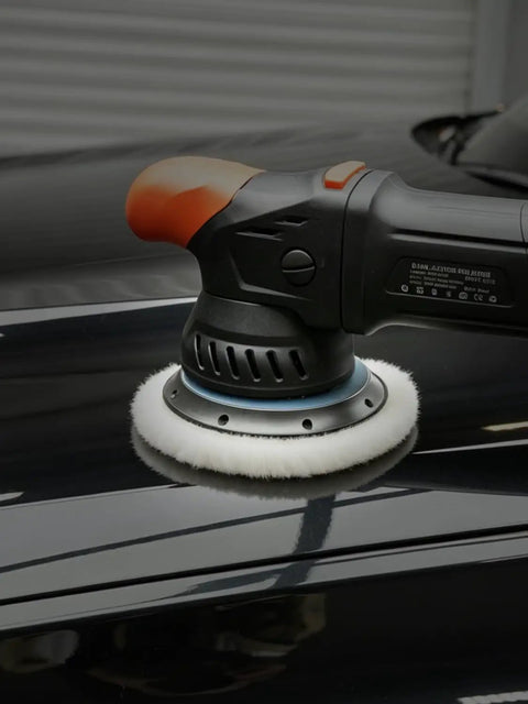 Car polisher with Wool Buffing Polishing Pads Set For 6 Inch Car Polisher, 3 Pack (150mm) in use on black car surface.