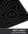 Close-up of Extra Large Gaming Mouse Pad With Black Topographic Print XXL Desk Mat For Gaming And Work showing corner detail with anti-fray edges.