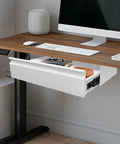 Slick 22 Inch Under Mount Desk Drawer Slide Out Kit with a white finish, mounted under a desk storing glasses and notebooks.