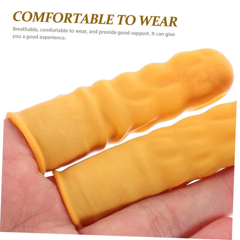 Close-up of Top Shelf 100 Pack Yellow Latex Finger Sleeves in hand, showing texture for grip and comfort during heavy lifting.