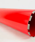 Side view of red 6-inch diamond core drill bit with segmented diamond edge for concrete and masonry drilling