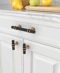 Three Inch Knurled Cabinet Handles Set Of Ten Featuring Matte Black And Champagne Bronze Colors on white cabinets.