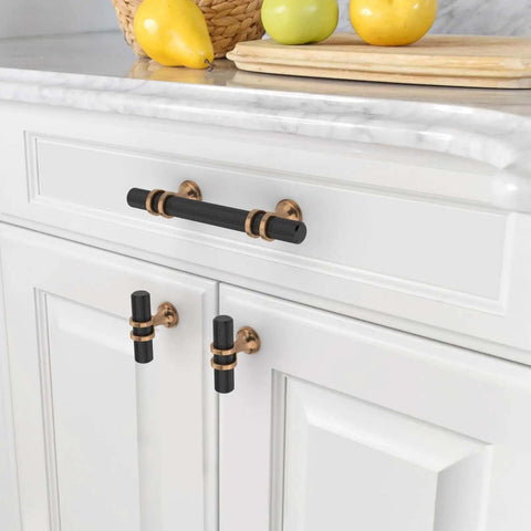 Three Inch Knurled Cabinet Handles Set Of Ten Featuring Matte Black And Champagne Bronze Colors on white cabinets.