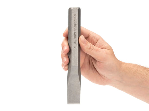 Hand holding One Inch Cold Chisel Heavy Duty Metal Cutter For Cutting Bolts, Rods, And Rivets, Shaping Cast Iron, Steel, Brass, Copper And Aluminum