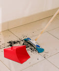 Red Handheld Dustpan And Scoop Shovel Grab And Go Cleanup Lightweight Plastic Trash Shovel With Wide 9.65 By 8.07 Inch Scoop on floor