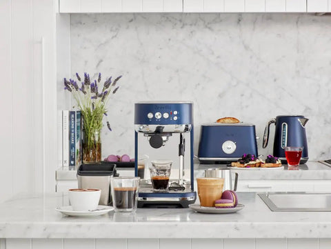 Damson Blue Kickass Espresso Coffee Maker Featuring Auto Milk Frother Quick Heat Technology And Reliable Pressure Pumping For Next Level Barista Quality Home Brews Any Day in modern kitchen setting.