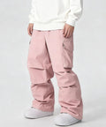 Men's Waterproof Insulated Ski Pants With Baggy Snowboard Style Fit For Winter Outdoor Sports in pink, side view