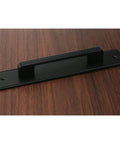 Premium Black Barn Door Pull Handles 2 Piece Set Heavy Duty Aluminum Sliding Closet Hardware With Rustproof Coating For Solid Grip and Smooth Performance on wooden surface.