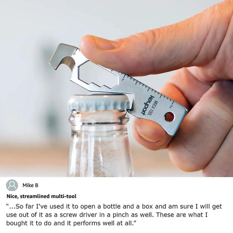 Close-up of a stainless steel 10 In 1 Keychain Multitool opening a bottle cap, showing pry bar and ruler features.