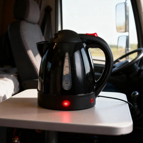 RigReady 24V 250W Portable Electric Kettle For Trucks And Rv on table, black, 1 liter capacity, auto shutoff feature.