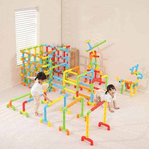 Two children playing with the No Fuss Learning 156 Piece Pipe Building Blocks Set, colorful interlocking tubes.